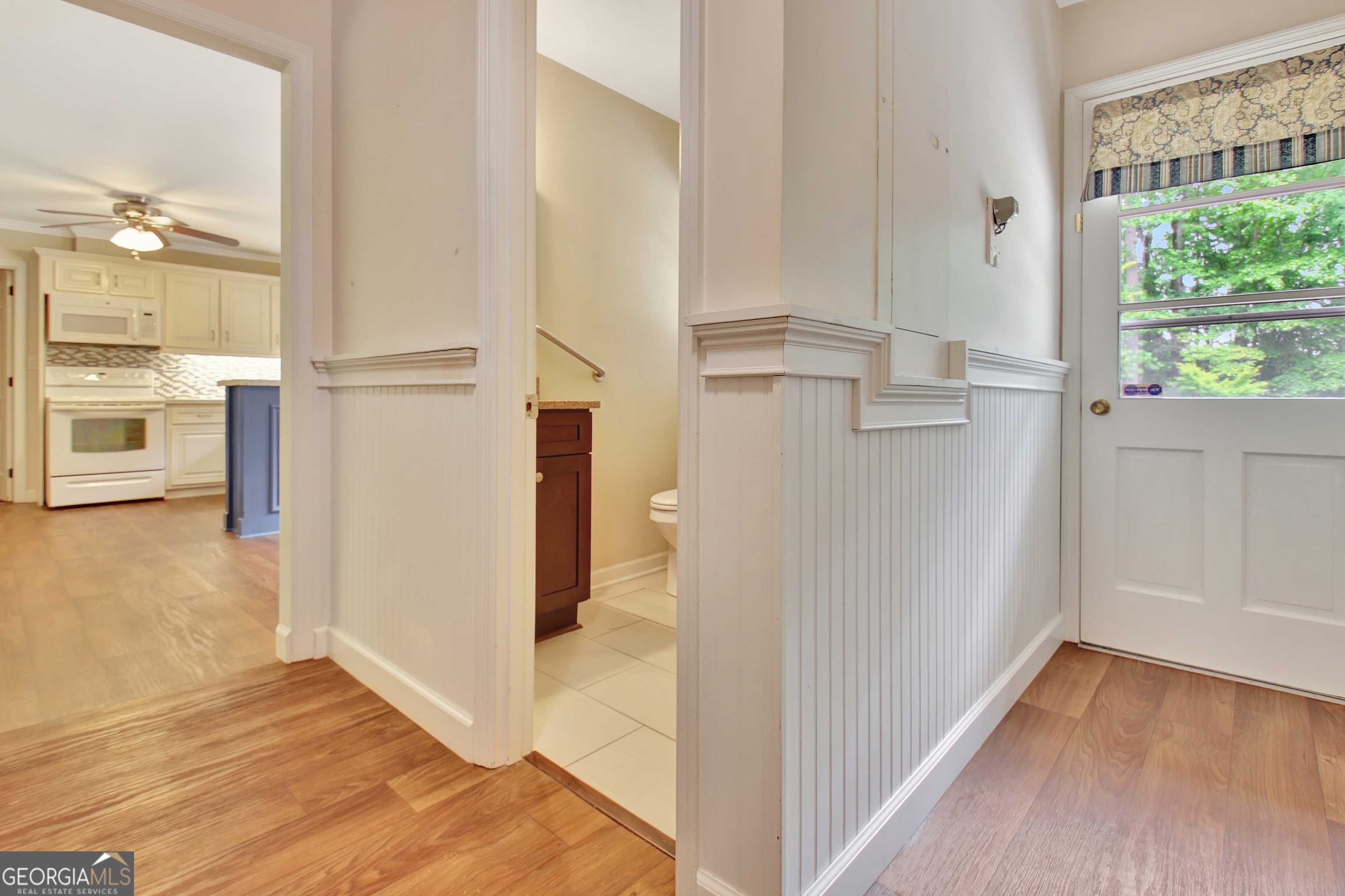 717 Tyrone Road Tyrone, GA 30290 - Photo 17 of 58 a view of a kitchen from the hallway with a floor to ceiling window
