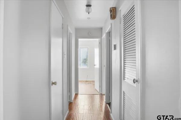 a view of a bathroom from a hallway