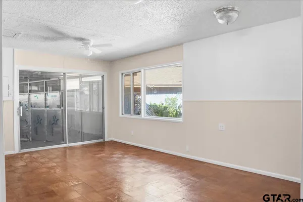 a view of an empty room with a window