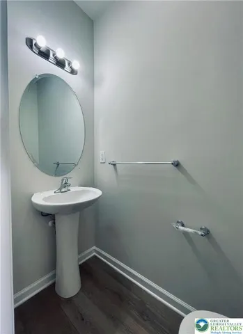 a bathroom with a sink and mirror