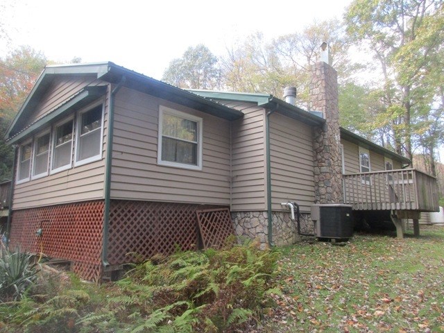 723 Burns Road Polk, PA 16342 - Photo 8 of 34 a view of a house with a yard and deck