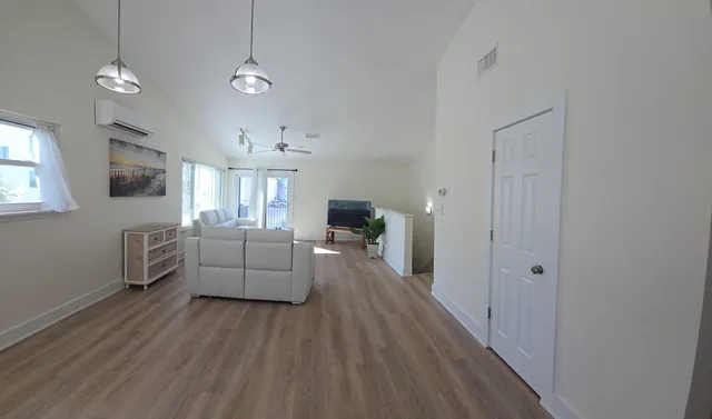 a kitchen with appliances a sink and cabinets