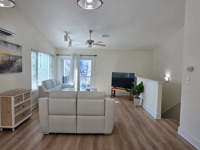a roof deck with patio and outdoor seating