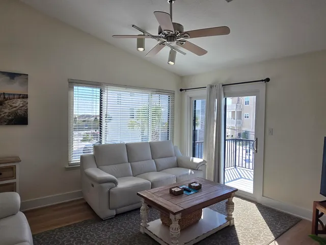 a view of a balcony dining table and chairs