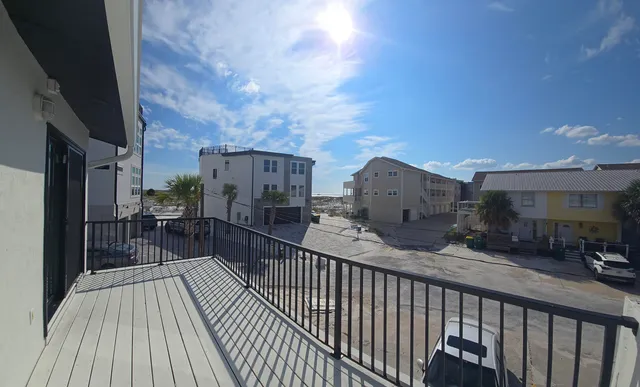 a view of a room with swing and table