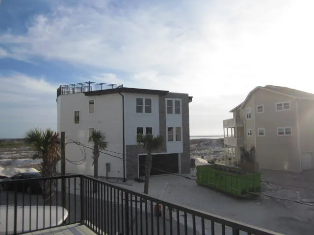 a kitchen with cabinets and wooden floor