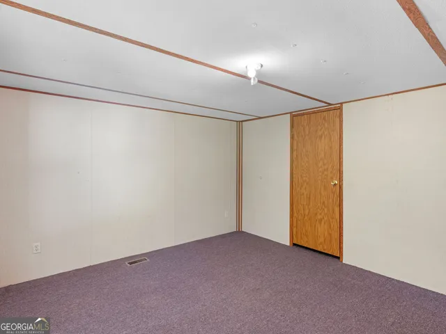 a bathroom with a sink toilet and a mirror