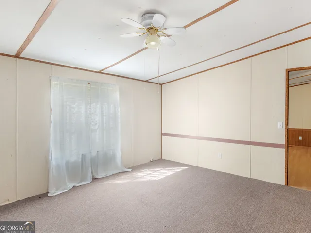 a bathroom with a bathtub and mirror