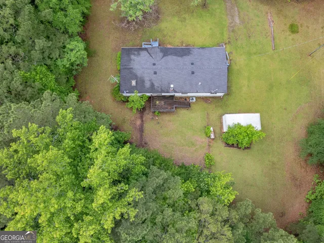 a view of a garden with a house