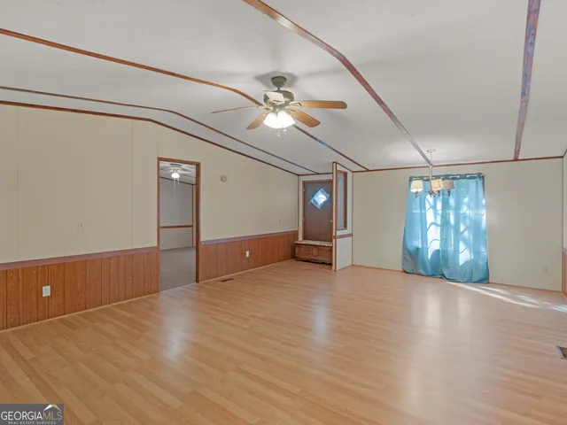 a view of a livingroom with wooden floor