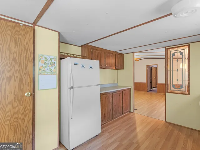 a kitchen with stainless steel appliances a refrigerator and a stove
