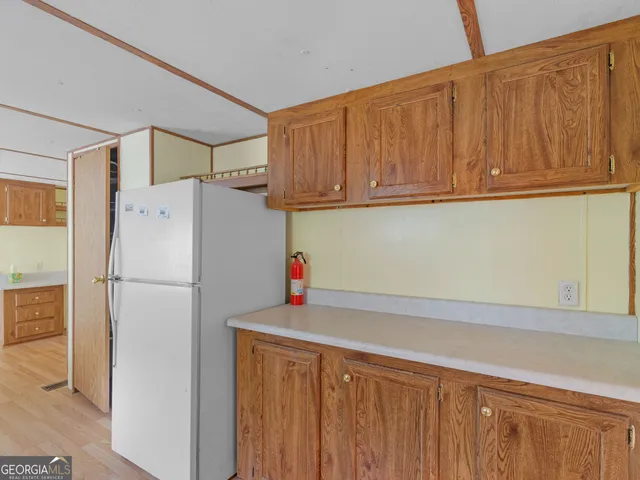 a white refrigerator freezer sitting in a kitchen