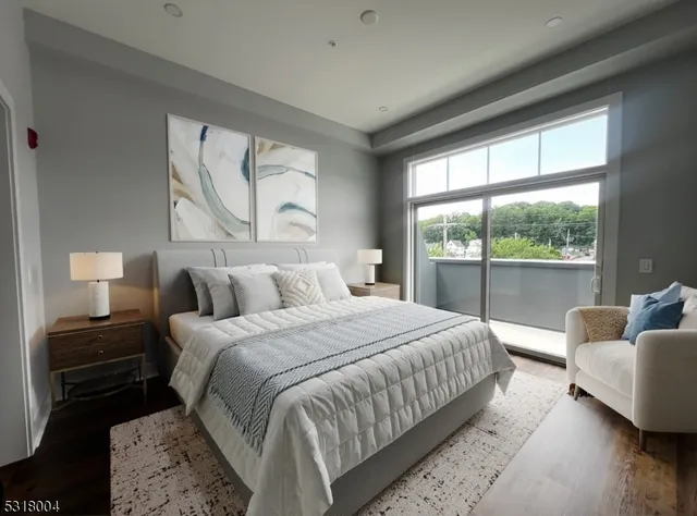 a bedroom with a bed and a large window