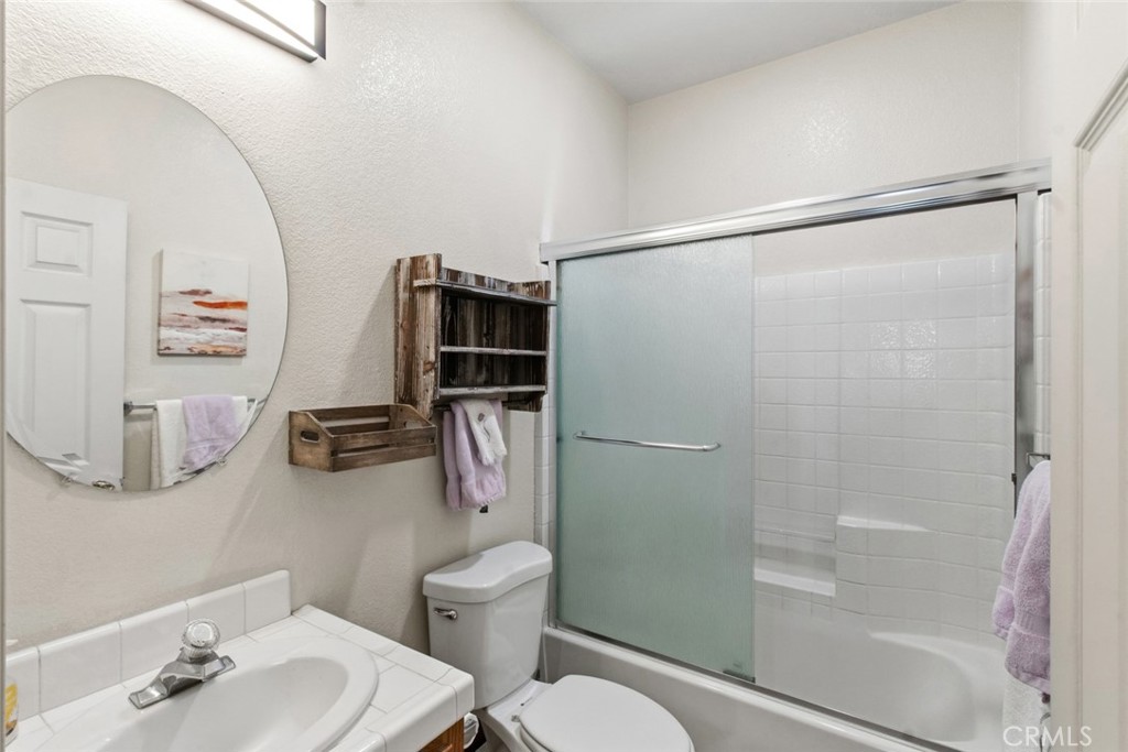 2408 Snap Dragon Court Modesto, CA 95355 - Photo 23 of 37 a bathroom with a toilet and a shower