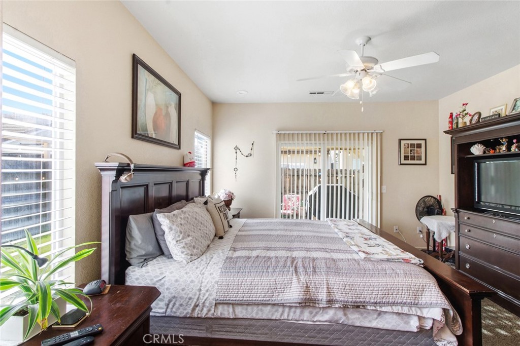 2408 Snap Dragon Court Modesto, CA 95355 - Photo 25 of 37 a bedroom with a bed furniture and a window