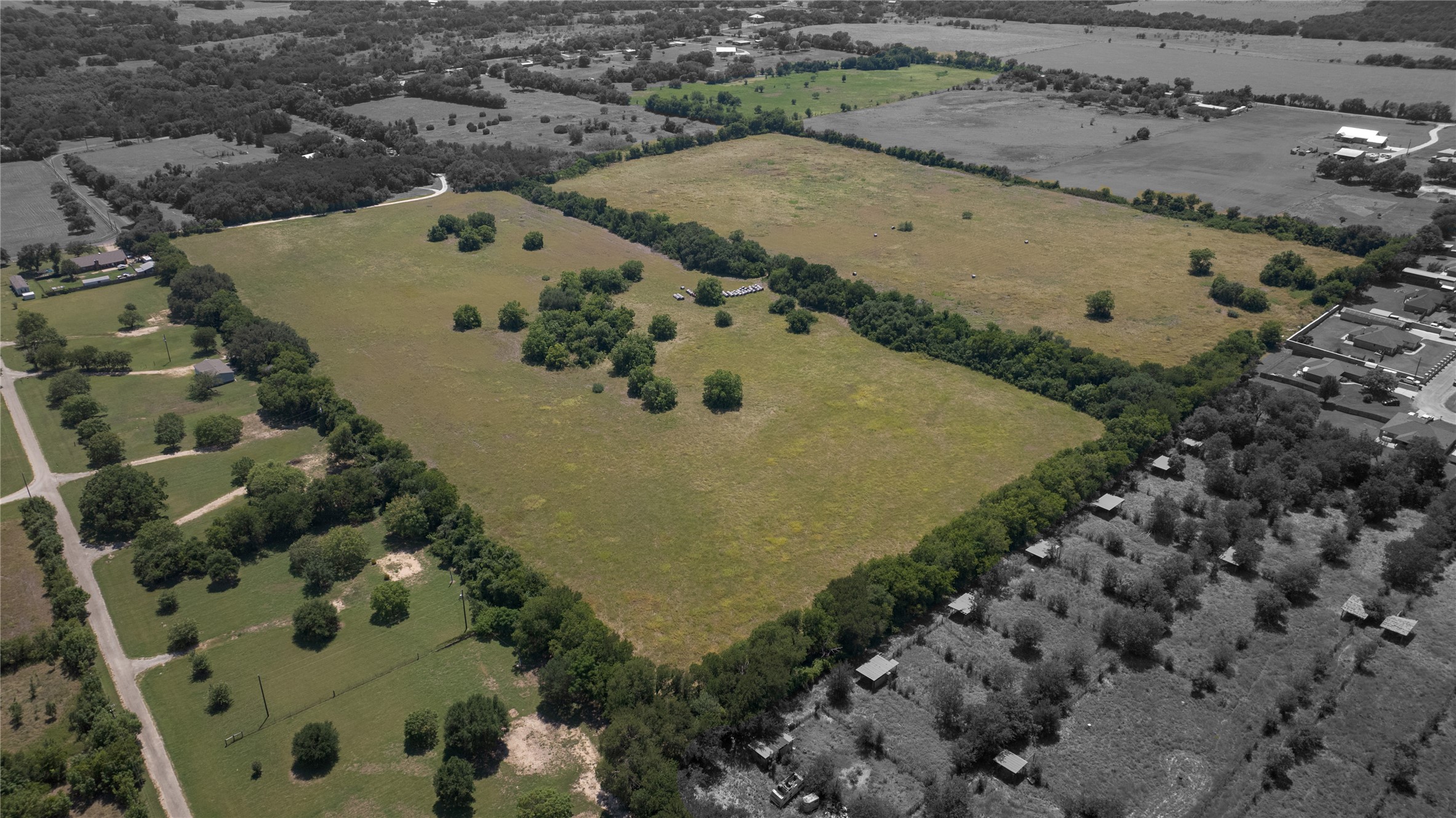 Tbd Summers Mill Road Belton, TX 76513 - Photo 7 of 21 Overlooking expansive fields, this property presents a peaceful, tree-lined landscape with abundant green space.