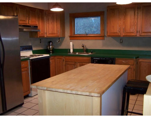 29 Spring Street Woonsocket, RI 02895 - Photo 6 of 15 a kitchen with stainless steel appliances a stove a refrigerator a sink and dishwasher