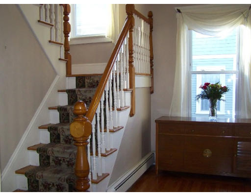 29 Spring Street Woonsocket, RI 02895 - Photo 8 of 15 a view of entryway and hall with wooden floor