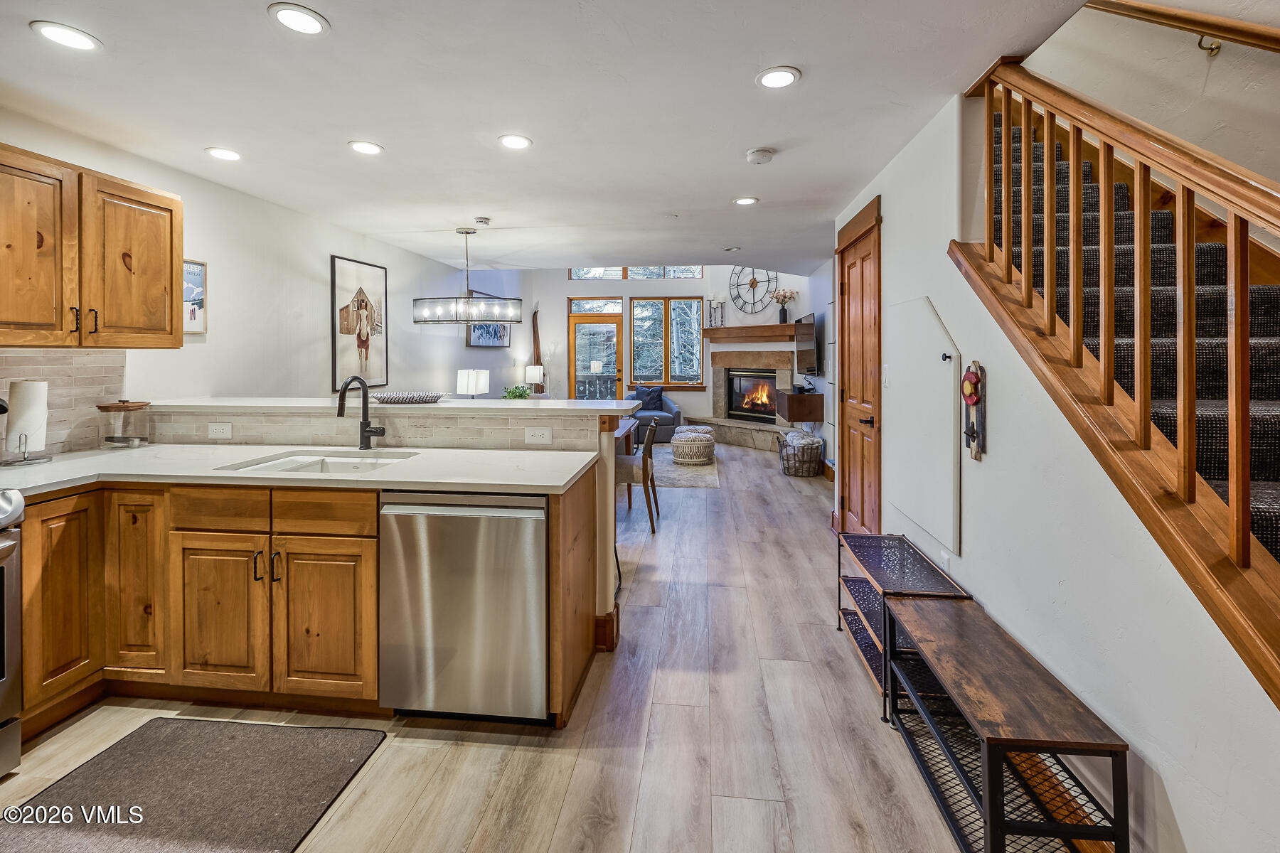 30 Cresta Road, Unit 306 Edwards, CO 81632 - Photo 3 of 26 a kitchen with stainless steel appliances granite countertop a refrigerator a sink dishwasher a stove and white countertops with wooden floor