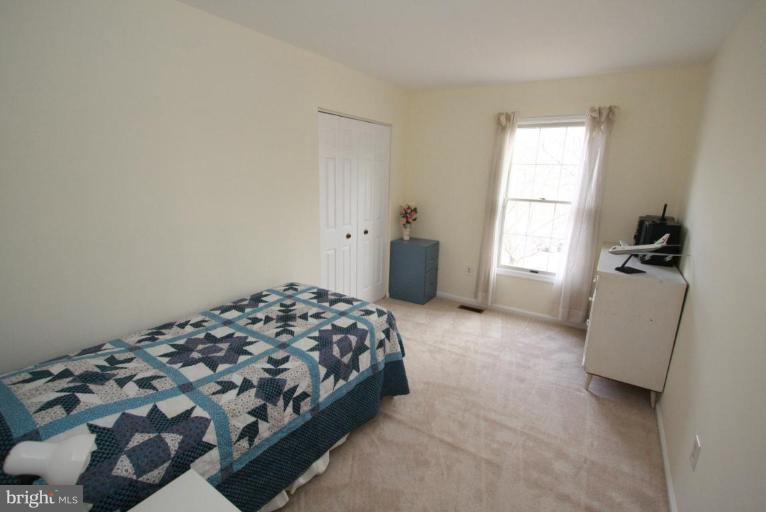 10 Autumn Ridge Court Silver Spring, MD 20906 - Photo 4 of 23 a bedroom with a bed and a window