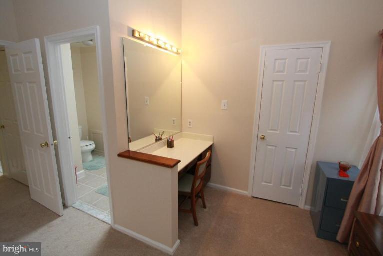 10 Autumn Ridge Court Silver Spring, MD 20906 - Photo 7 of 23 a utility room with sink and mirror