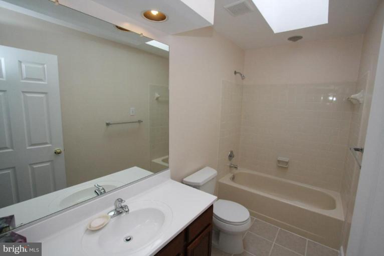 10 Autumn Ridge Court Silver Spring, MD 20906 - Photo 10 of 23 a bathroom with a sink a toilet and shower