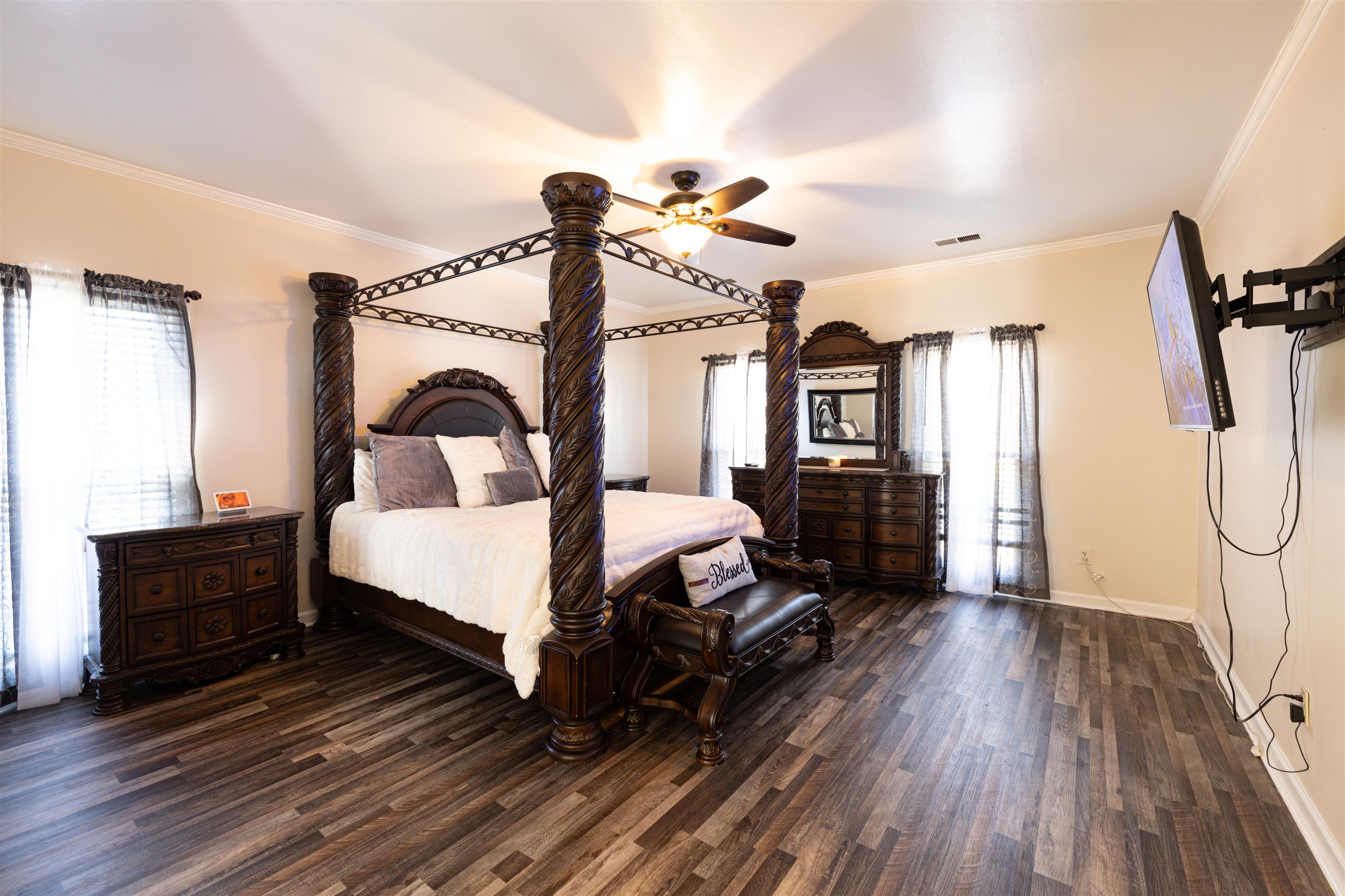 6801 Stout Road Memphis, TN 38119 - Photo 12 of 25 a bedroom with a bed a flat tv screen and dresser