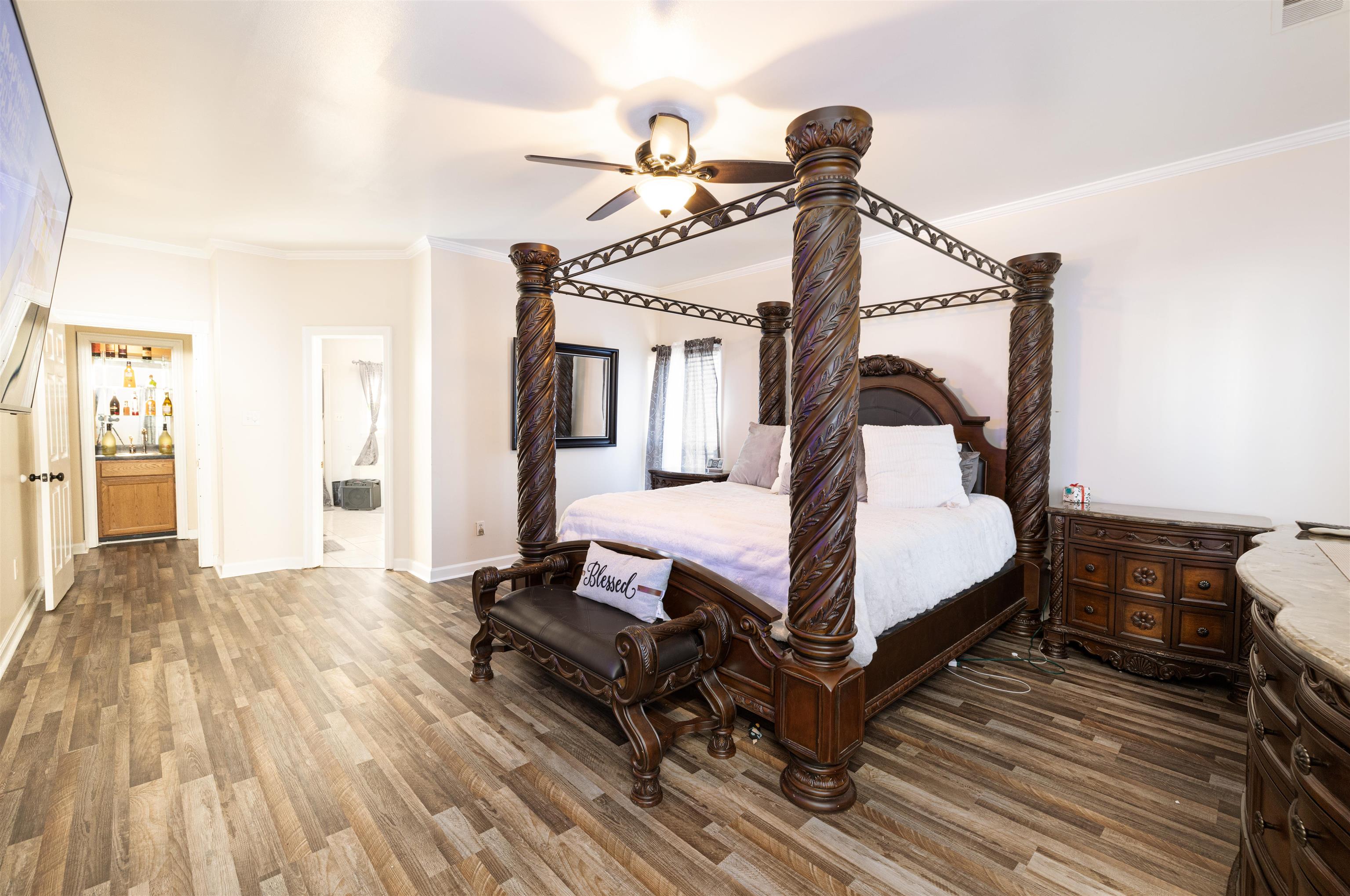 6801 Stout Road Memphis, TN 38119 - Photo 13 of 25 a bedroom with a bed and wooden floor