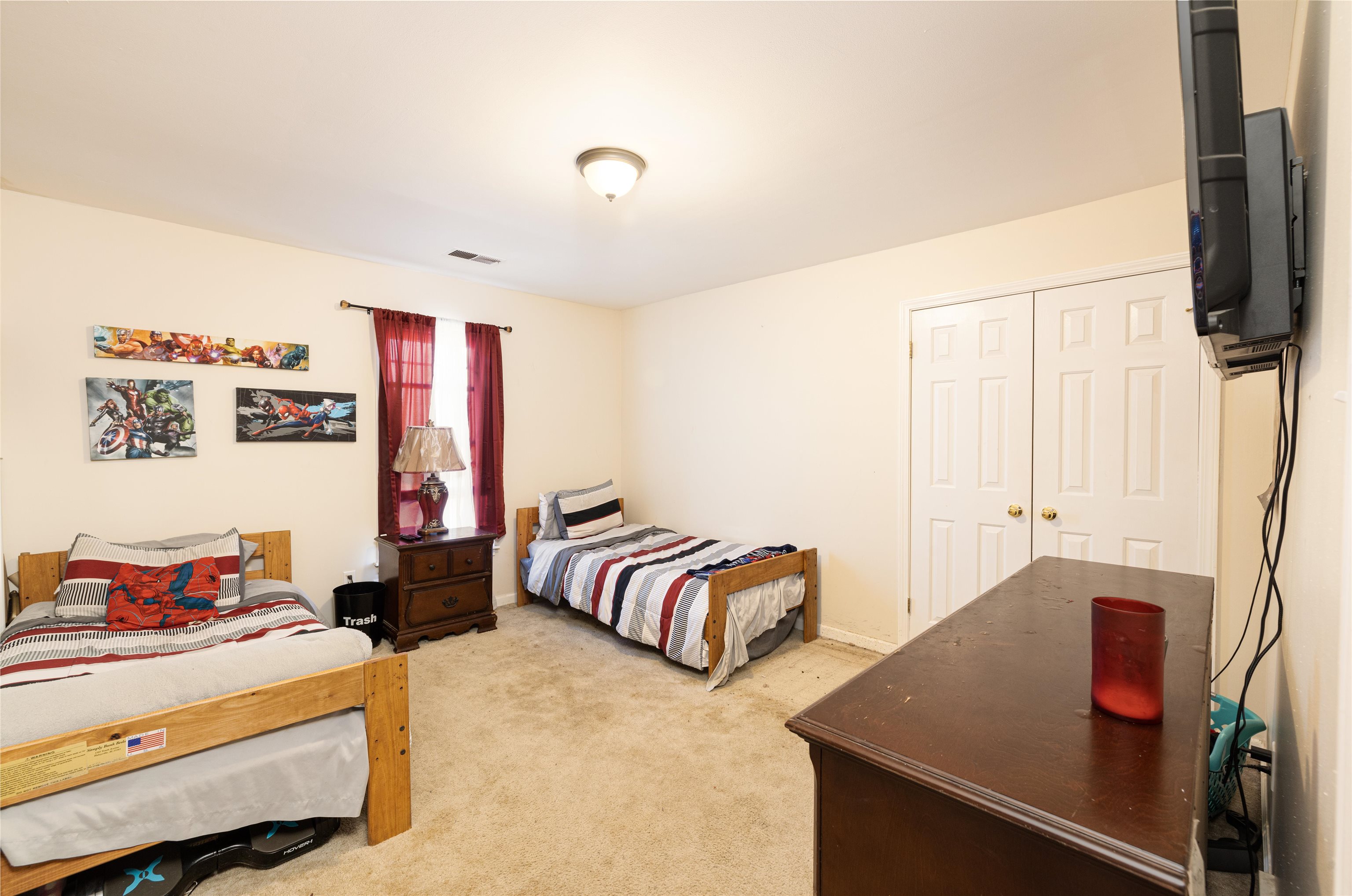 6801 Stout Road Memphis, TN 38119 - Photo 23 of 25 a bedroom with furniture and a flat screen tv