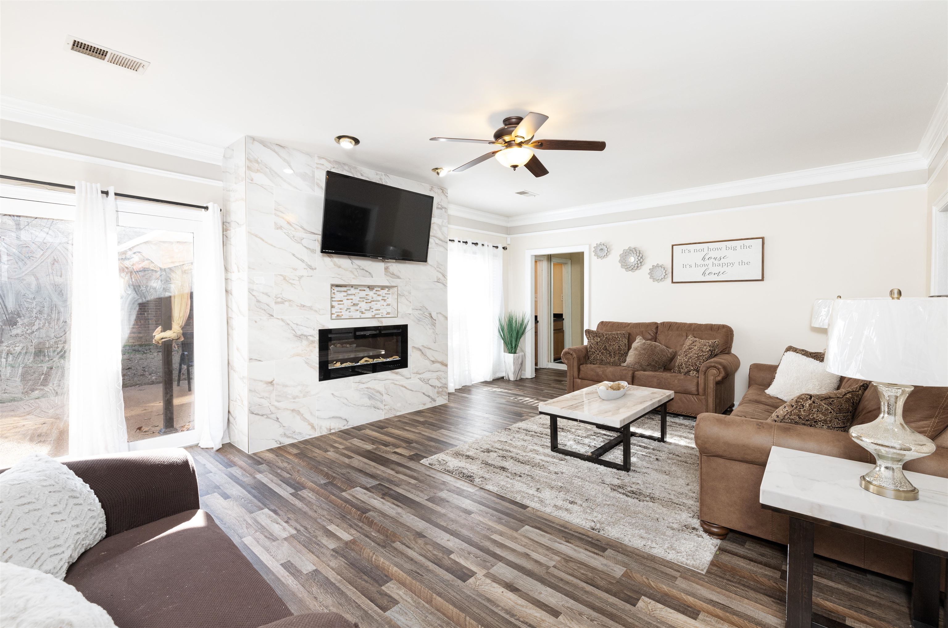 6801 Stout Road Memphis, TN 38119 - Photo 4 of 25 a living room with furniture fireplace and flat screen tv