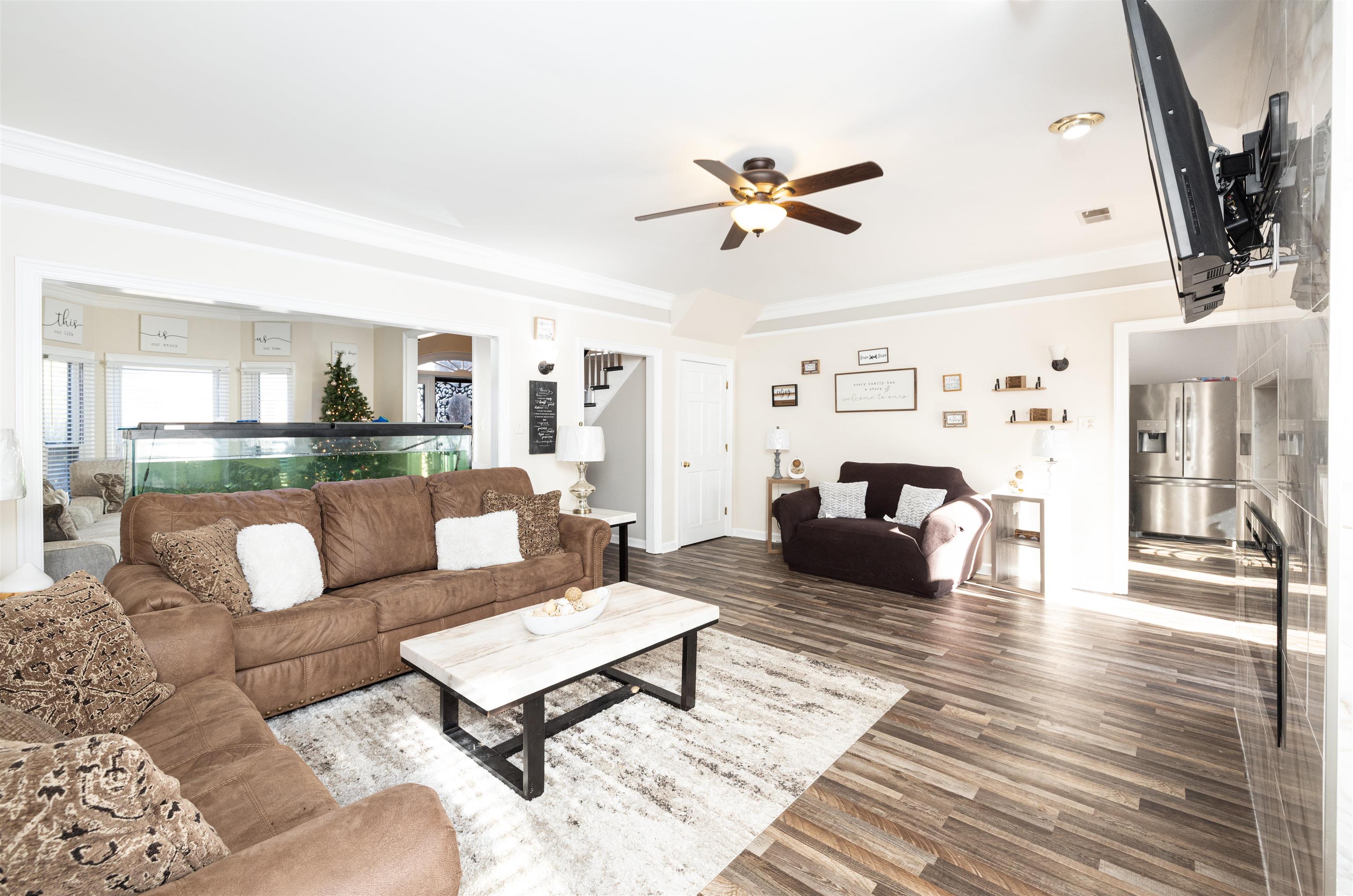 6801 Stout Road Memphis, TN 38119 - Photo 6 of 25 a living room with furniture and a wooden floor
