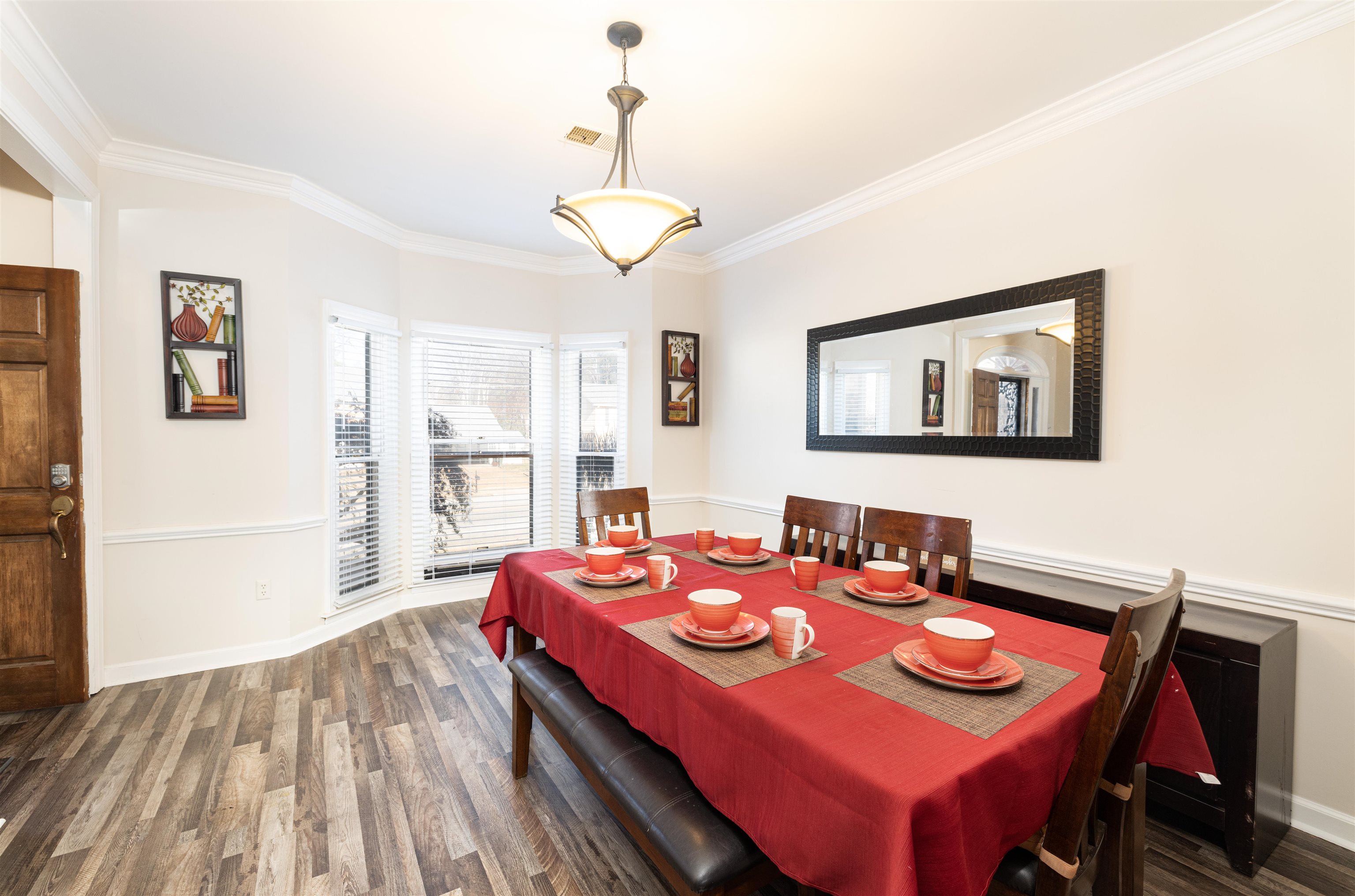 6801 Stout Road Memphis, TN 38119 - Photo 8 of 25 a view of a dining room with furniture window and wooden floor