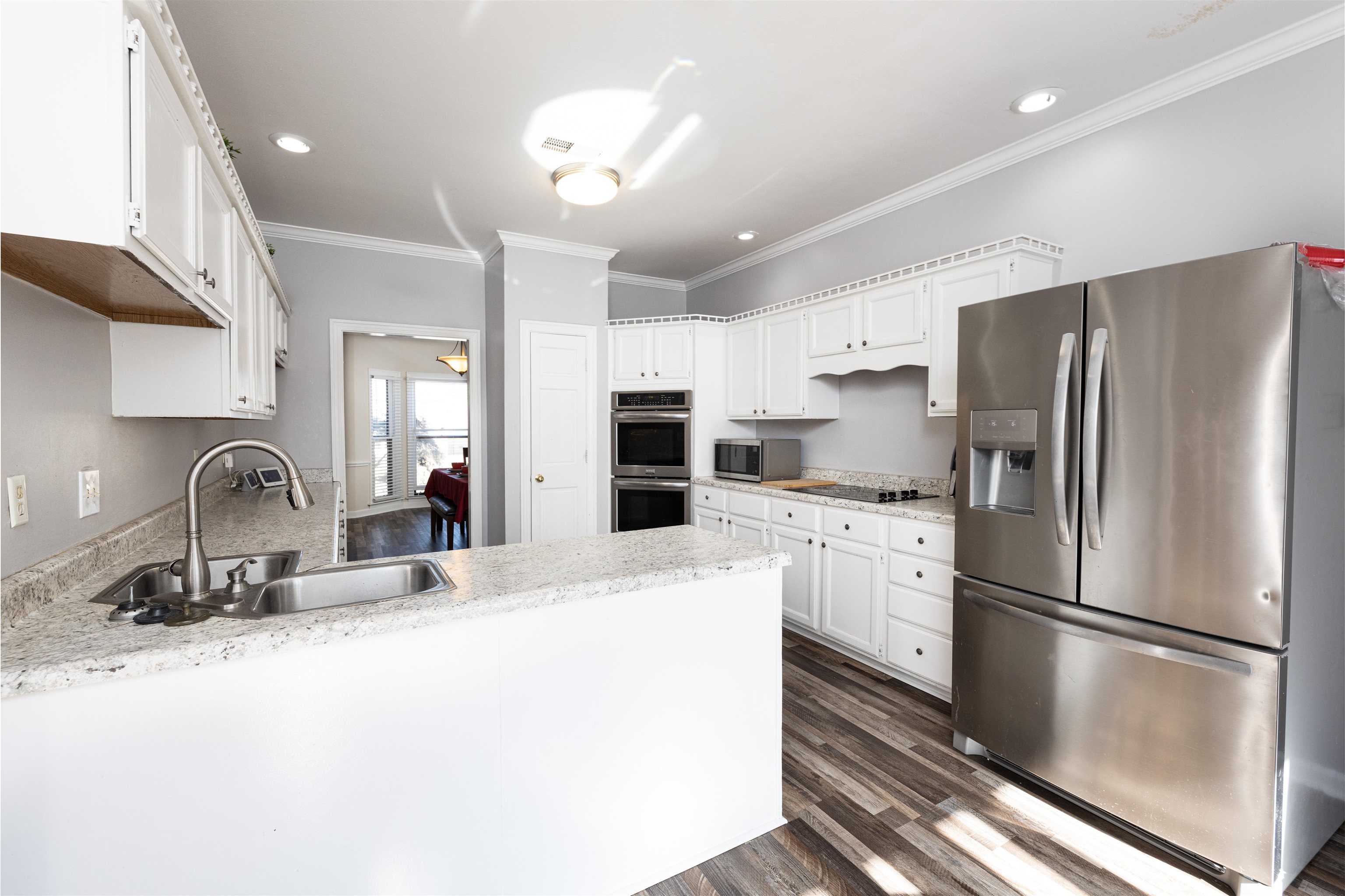 6801 Stout Road Memphis, TN 38119 - Photo 9 of 25 a kitchen with stainless steel appliances a refrigerator sink and microwave