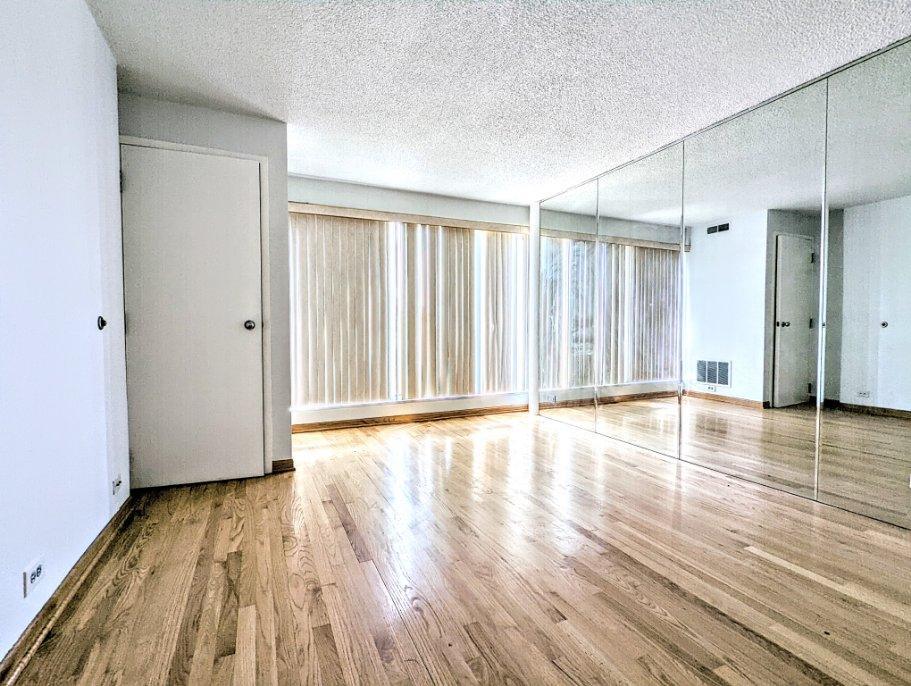 2555 Gross Point Road, Unit 407 Evanston, IL 60201 - Photo 10 of 10 a view of a livingroom with wooden floor