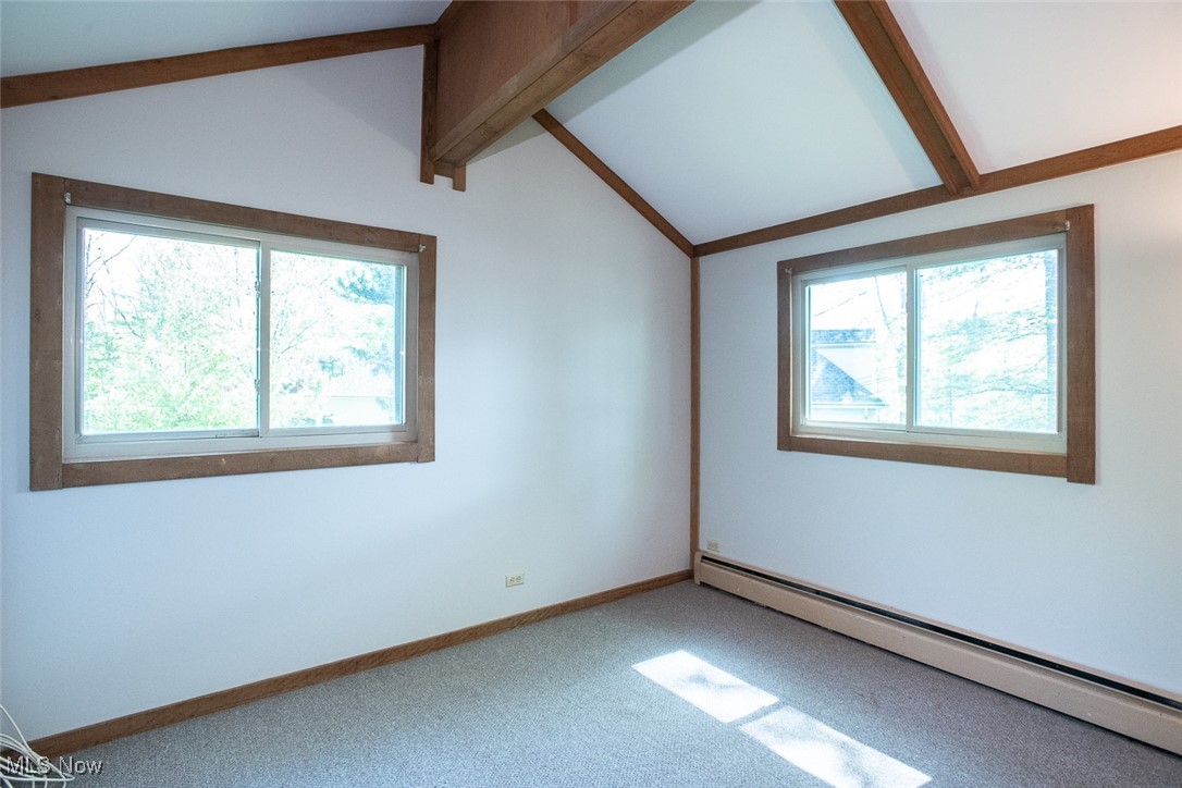 41180 Butternut Ridge Road Elyria, OH 44035 - Photo 29 of 50 Carpeted spare room featuring a baseboard heating unit and baseboards