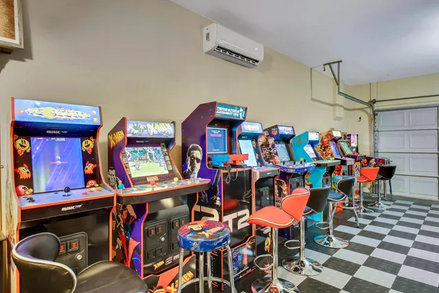 a spacious en suite bathroom with a double vanity sink a mirror and a bathtub