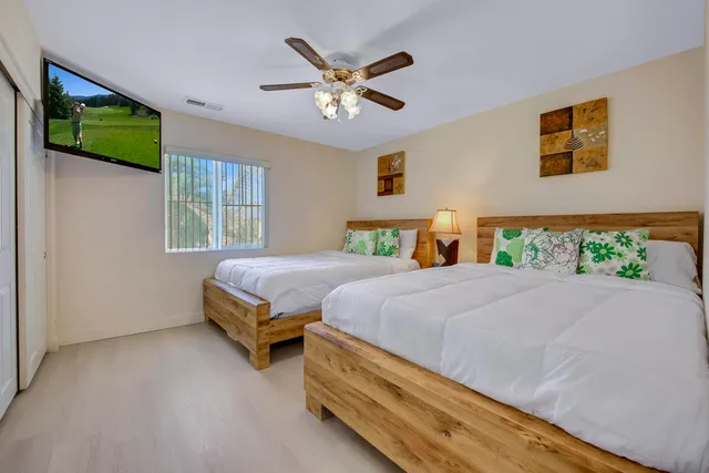 a bedroom with bunk bed and a window