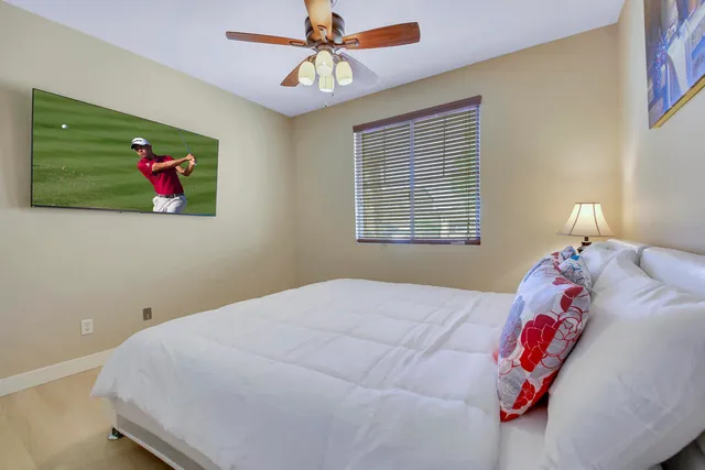 a bathroom with a sink a toilet and shower curtain
