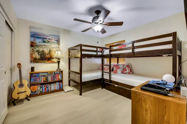 a room with furniture pool table and window