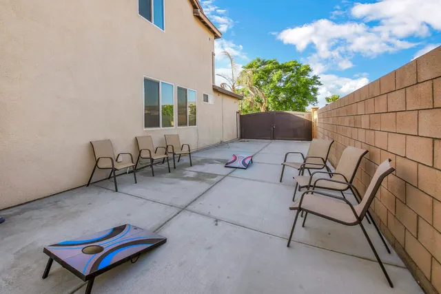 a view of a chairs and table in the patio