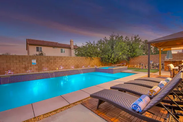 a backyard of a house with outdoor seating