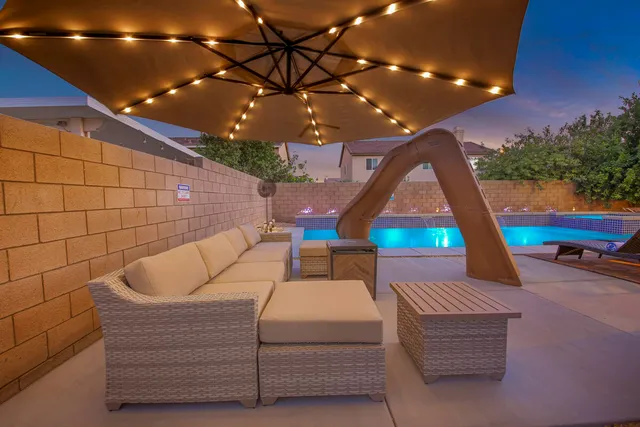 a balcony with table and chairs