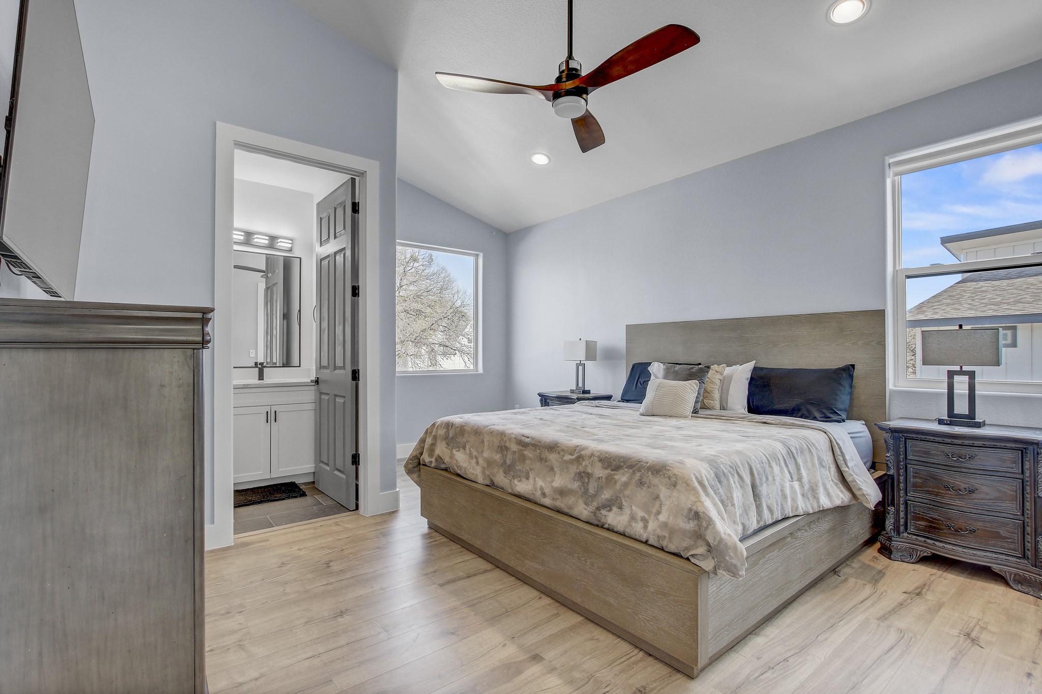 4703 Louis Avenue, Unit A Austin, TX 78721 - Photo 25 of 35 Bedroom featuring lofted ceiling, light wood finished floors, a ceiling fan, and recessed lighting
