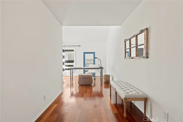 a view of a livingroom with furniture and wooden floor