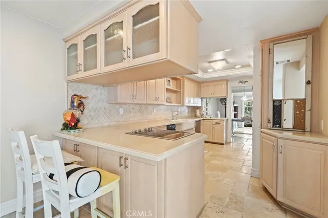 a kitchen with stainless steel appliances granite countertop a stove and white cabinets