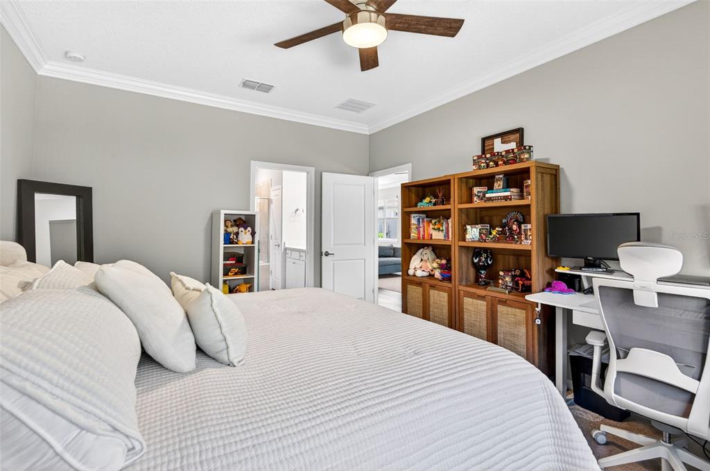 6427 Mooring Line Circle Apollo Beach, FL 33572 - Photo 28 of 34 a bedroom with a bed a study table and large window