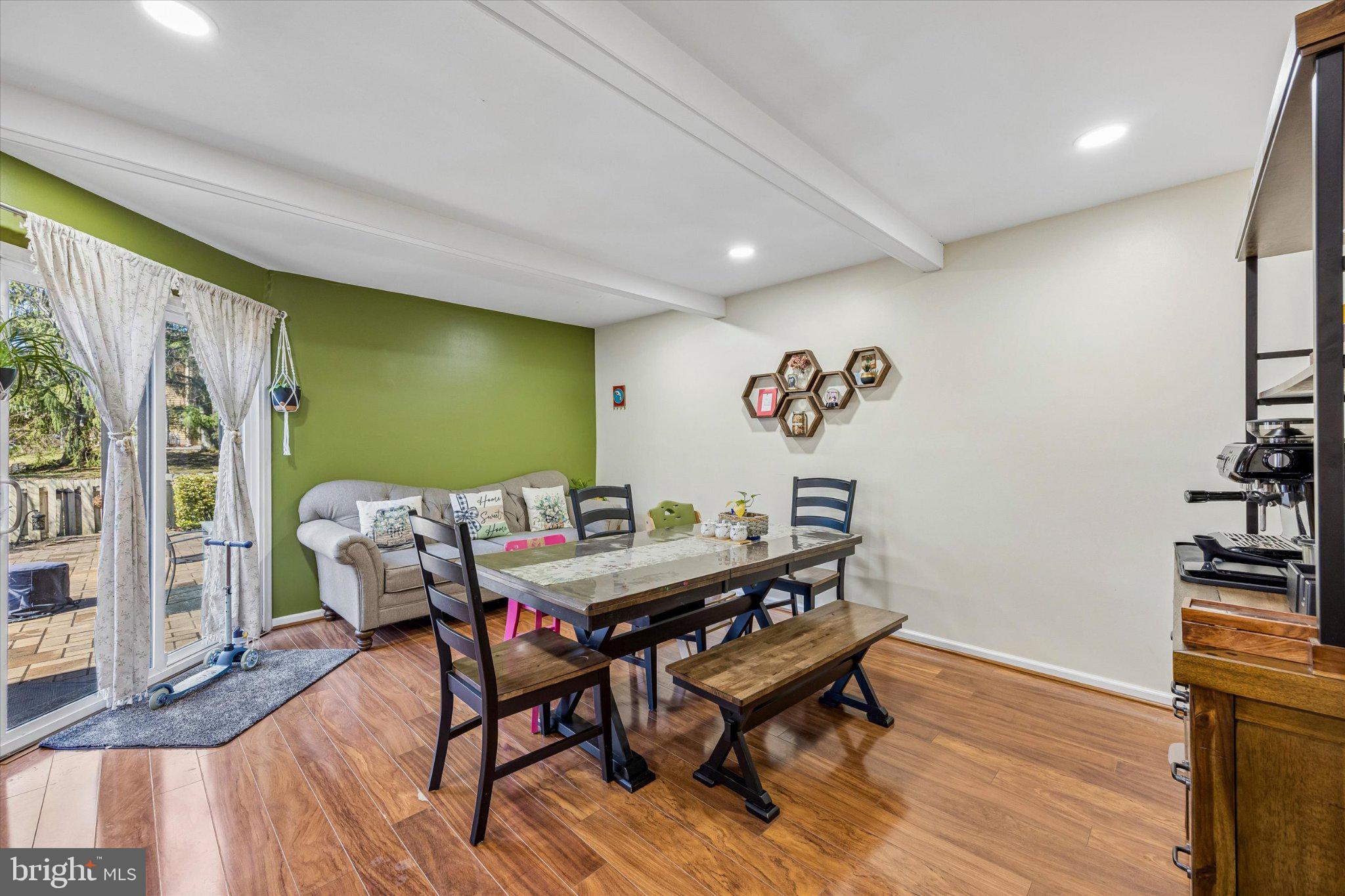 24 Independence Place Newtown, PA 18940 - Photo 7 of 15 a view of a dining room with furniture and wooden floor