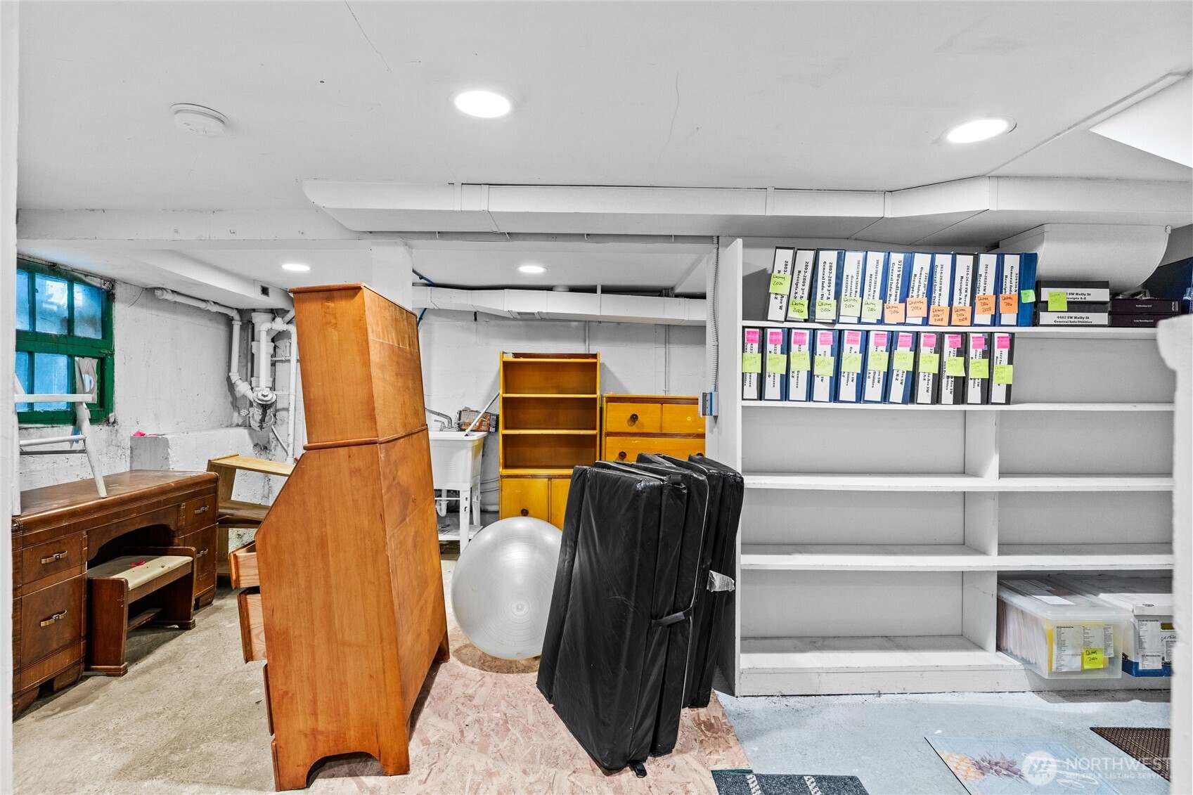 4431 Southwest Admiral Way Seattle, WA 98116 - Photo 12 of 25 a view of walk in closet with clothes and shoes