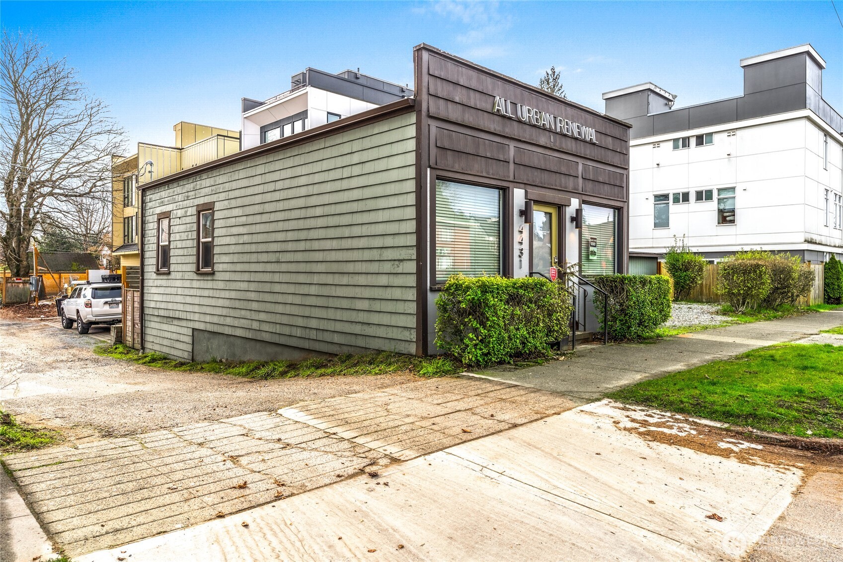 4431 Southwest Admiral Way Seattle, WA 98116 - Photo 20 of 25 a view of a house with a yard