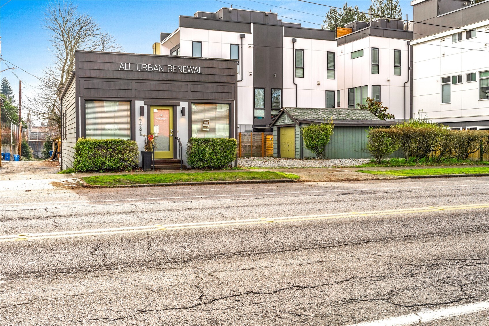 4431 Southwest Admiral Way Seattle, WA 98116 - Photo 22 of 25 a view of a brick building next to a yard
